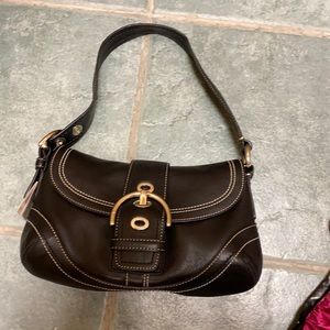 Medium Coach everyday black leather purse.